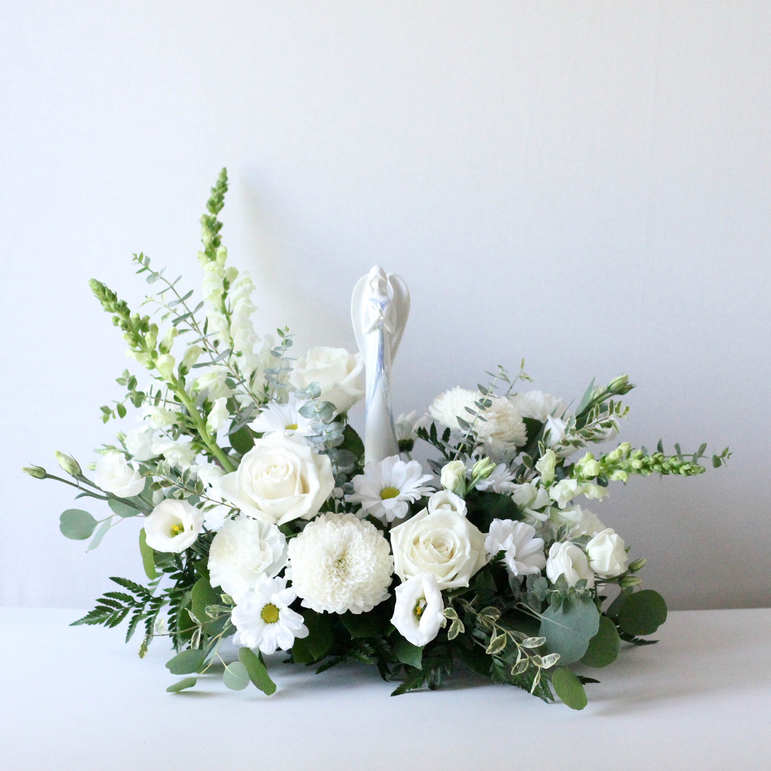 Mary - A lovely table top floral design with a ceramic Mary included