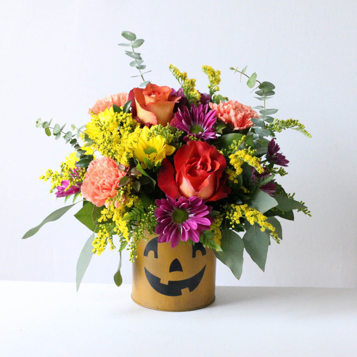 Jack - A flower pot painted to resemble a Jack-O-Lantern