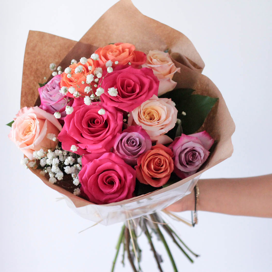 Wrapped Multicolored Dozen Roses with Babies' Breath and Greens - PICK UP ONLY