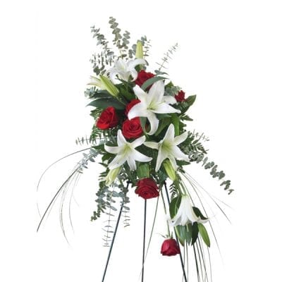 Funeral Spray in reds and whites with an asymetrical shape.